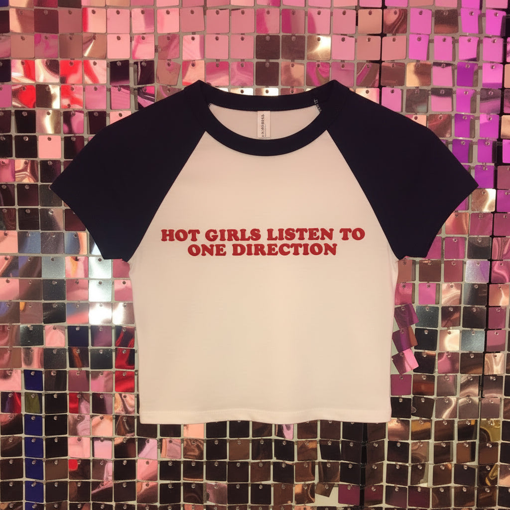 White shirt with red text on a colorful tiled background