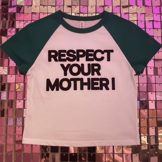 Pink and green baseball shirt with 'RESPECT YOUR MOTHER!' text on a colorful tiled wall.