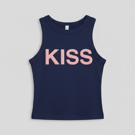 Navy blue tank top with 'KISS' printed in pink on a hanger against a reflective, multicolored background.
